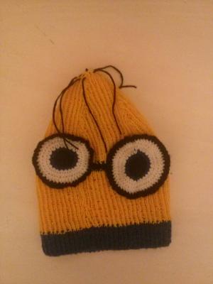 Kids hat modelled after minions figure.